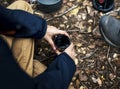 Man drinking coffee in a forest Royalty Free Stock Photo