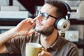 Man drinking coffee and listening to music Royalty Free Stock Photo