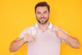 Man drinking fresh water. Male model holds glass of clear water. Healthy lifestyle, health care. Mineral water Royalty Free Stock Photo