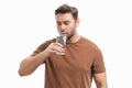 Man drinking fresh water. Male model holds glass of clear water. Healthy lifestyle, health care. Mineral water Royalty Free Stock Photo