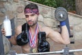 Man drinking milk and winning lots of medals in boxing