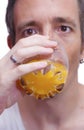 Man drinking orange juice Royalty Free Stock Photo