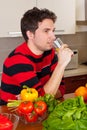 Man drinking orange juice in kitchen Royalty Free Stock Photo