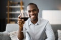 Man Drinking Red Wine In Video Conference Royalty Free Stock Photo