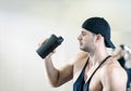 Man drinking shake in gym