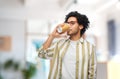 man drinking takeaway coffee at office Royalty Free Stock Photo