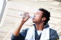 Man is drinking water after exercising