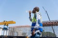 Man Drinking Water Outdoors on Hot Day, Engineer Man Drinking Water at Site, Construction Worker Staying Hydrated on Site Royalty Free Stock Photo