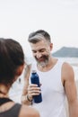 Man drinking water to rehydrate