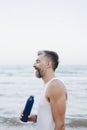 Man drinking water to rehydrate