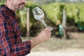 man drinking wine at vineyard on sunny day