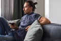 Man drinking wine and watching TV Royalty Free Stock Photo