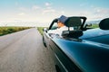 Man drive cabriolet car on province mountain road Royalty Free Stock Photo