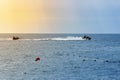 Man drive freestyle jet ski at summer sunset. Summer background