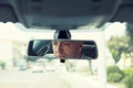 Man driver reflection in rear view mirror isolated interior car windshield background Royalty Free Stock Photo