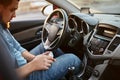 Man driver using mobile phone while sitting at the wheel of a car Royalty Free Stock Photo