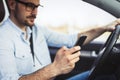 Man driver using smart phone in car modern Royalty Free Stock Photo