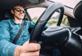 Man drives a car - inside wide angle view