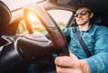 Man drives a car - inside wide angle view