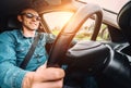 Man drives a car - inside wide angle view