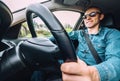 Man drives a car - inside wide angle view