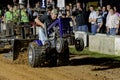 A Man Drives at a Lawn Tractor Pull