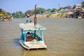 A man drives a wooden boat to take a boat to travel on the Chao Phraya River, Nakhon Sawan,