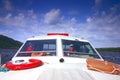 Man driving a boat on a sunny Royalty Free Stock Photo