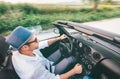 Man driving cabriolet car by province mountain road top view imaage