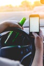 A man driving a car with a bottle of beer and phone Royalty Free Stock Photo