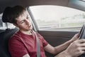 Man driving car and fell asleep and does not control the road situation. Drugged with alcohol or insomnia concept. Car crashes and Royalty Free Stock Photo