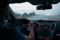 Man driving a car in fog. Back view Royalty Free Stock Photo