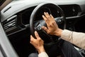 Man driving a car with hand on horn button Royalty Free Stock Photo