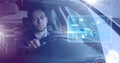 Man driving in car with heads up display interface