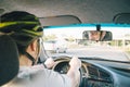 Man driving car in helmet with horror on her face Royalty Free Stock Photo