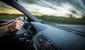 Man driving a car moving fast on a highway Royalty Free Stock Photo
