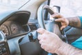 Man driving a car. Person drives a right-hand drive car