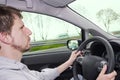 Man driving a car in the rain Royalty Free Stock Photo