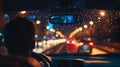 Man driving car in rainy night. Blurred city background. Royalty Free Stock Photo