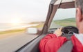 A man driving a car rushes along the highway. Royalty Free Stock Photo