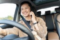 A man is driving a car and talking on his cell phone Royalty Free Stock Photo