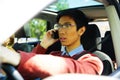 Man driving car and talking on mobile phone Royalty Free Stock Photo