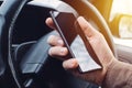 Man driving car and using mobile phone for texting Royalty Free Stock Photo