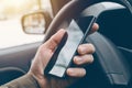 Man driving car and using mobile phone for texting Royalty Free Stock Photo