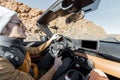 Man driving cabriolet car on the desert road