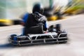 A man is driving Go-kart with speed in the park. Royalty Free Stock Photo