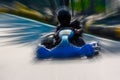 A man is driving Go-kart with speed in the park. Royalty Free Stock Photo