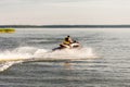 A man driving a jet ski , stunting and making spray of water drops Royalty Free Stock Photo