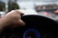 A man driving a left hand to hold the steering wheel To control the car carefully While traffic congestion, has copyspace on top Royalty Free Stock Photo
