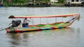 Man driving a longtail boat